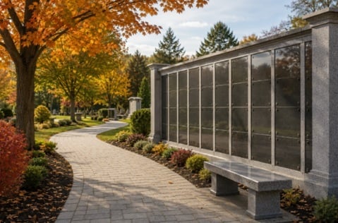 Accessible walkway beside a granite columbarium wall at a peaceful cemetery in Albany, NY